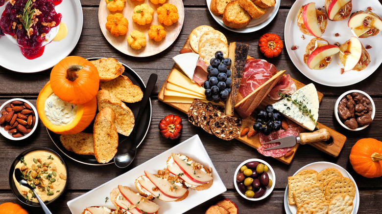 cheese board with various crackers and accoutrements