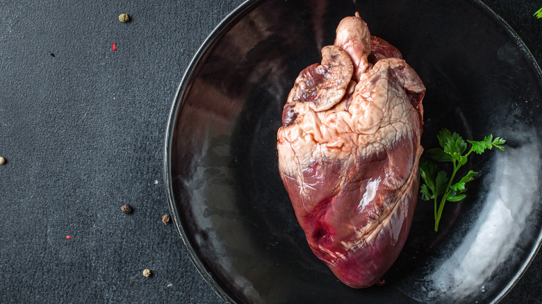 Lamb heart on black plate