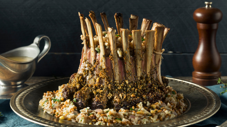 a lamb crown roast presented on rice