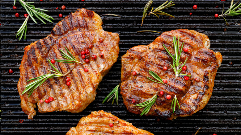 Two pork chops and rosemary