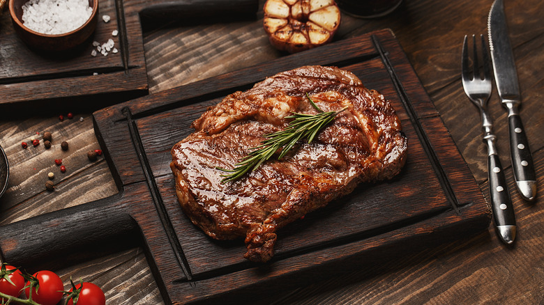 Steak on wooden serving tray