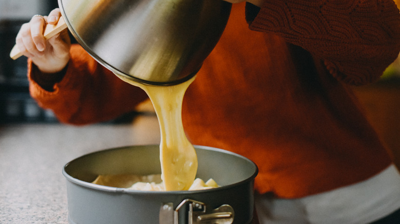 chef pouring cake batter