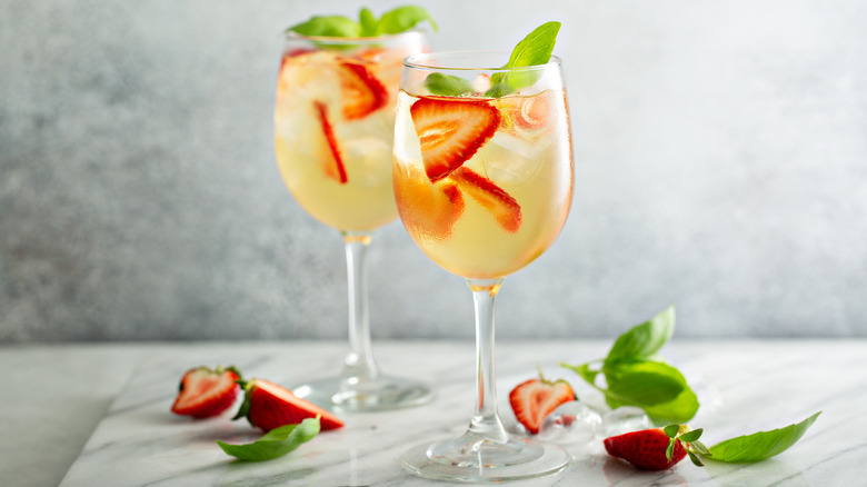 glasses of white sangria with berries