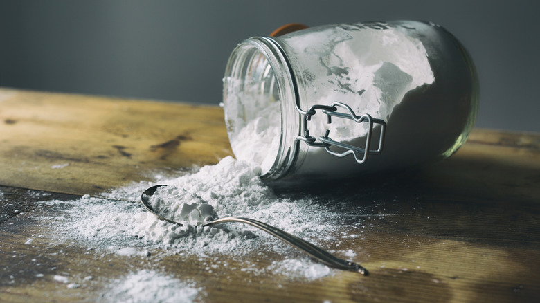 Powder spilling out of jug