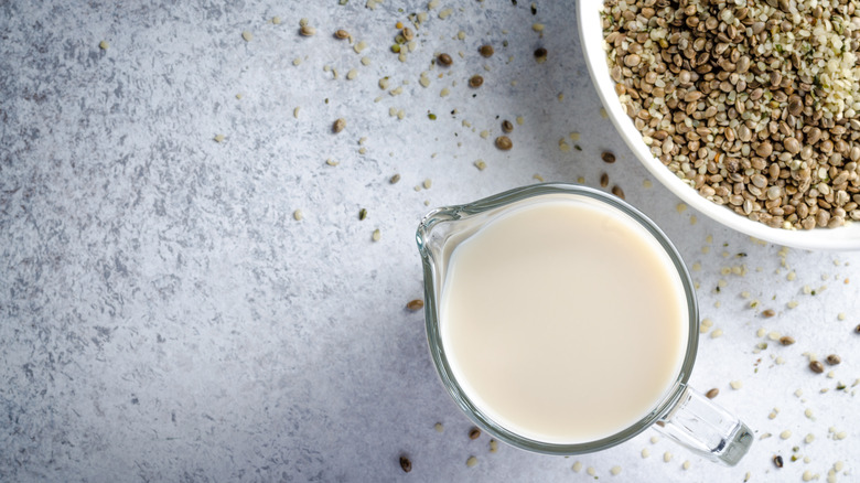 Hemp milk in a glass with hemp seeds