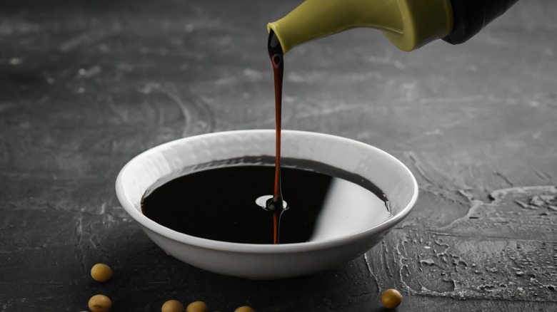 pouring soy sauce