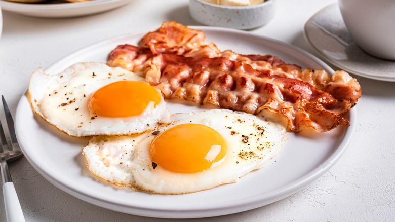 Fried eggs and bacon on a plate