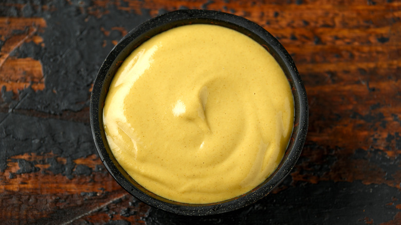 Dijon mustard on wood background