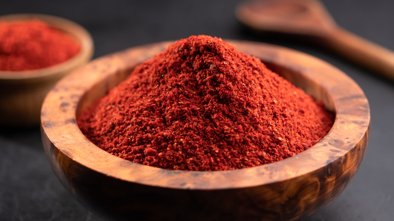 Red paprika in wood bowl