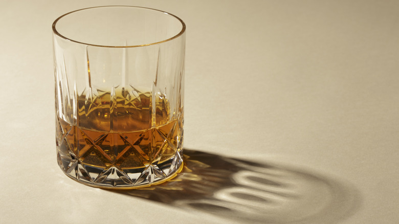 Glass of scotch whiskey served neat in a rocks glass