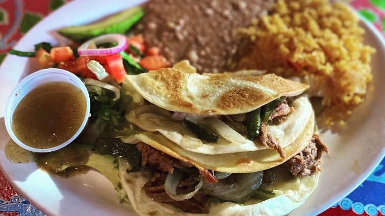 brisket tacos with rice, beans, and pico de gallo