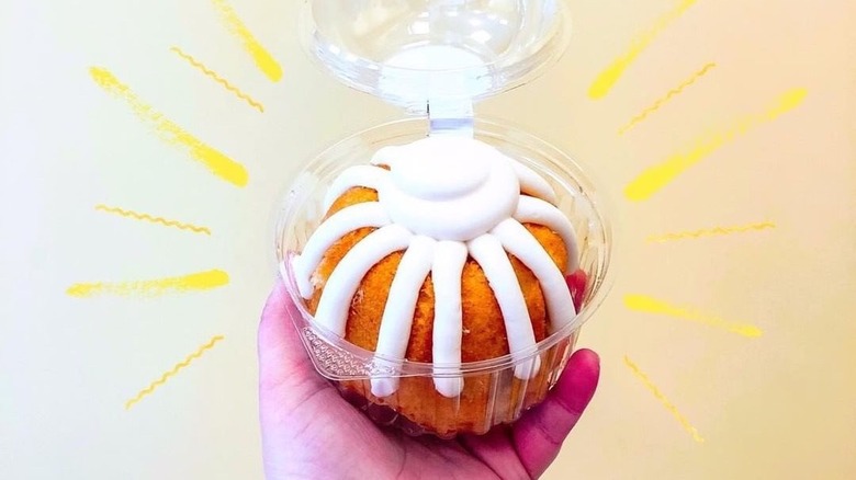 Container with lemon Bundt cake