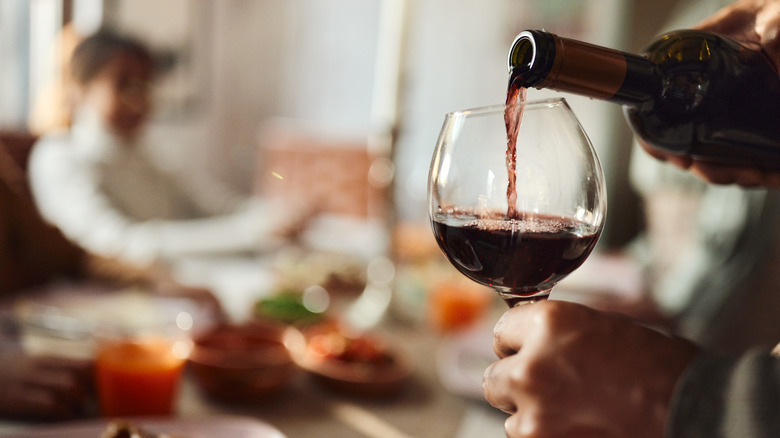 pouring glass of red wine