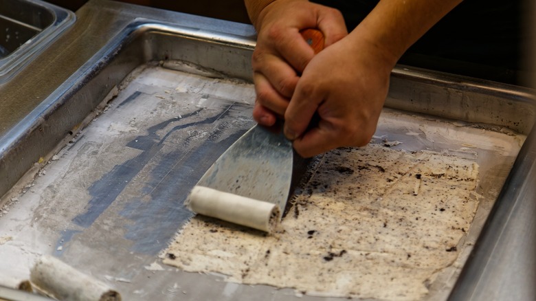 rolling ice cream in a rimmed sheet pan