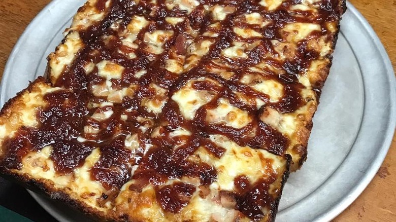 BBQ pizza on serving tray