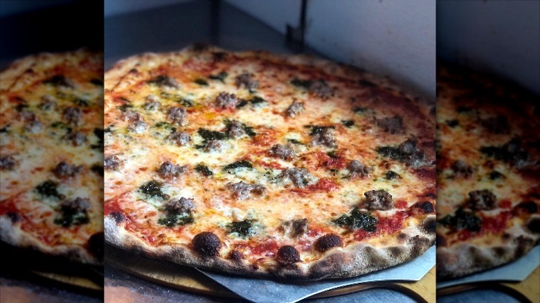 A pizza with charred crust