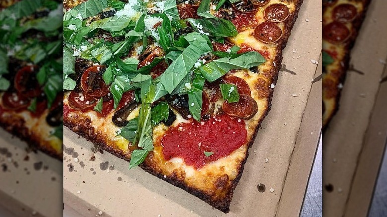 Square pizza with herbs