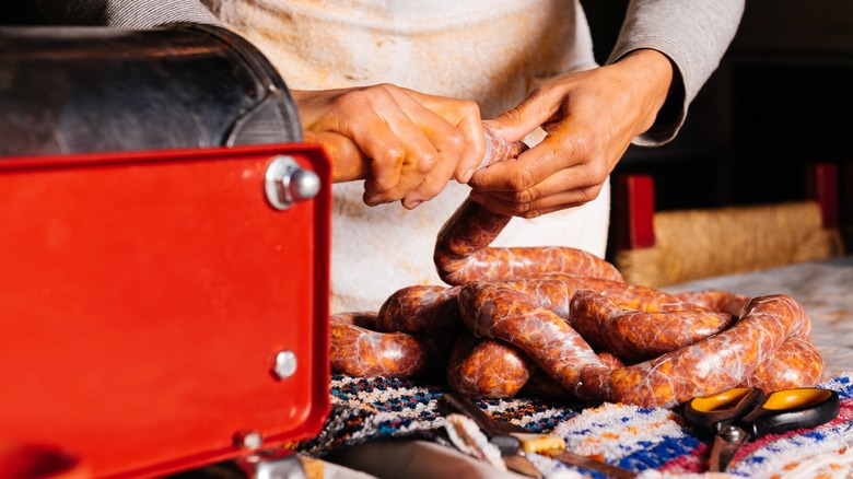 Woman making sausage