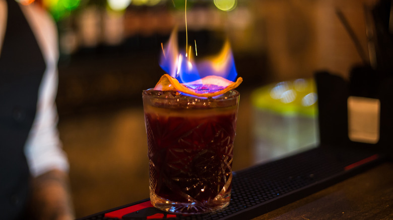 Flamed, craft cocktail on bar