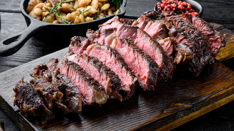 Sliced prime rib on cutting board