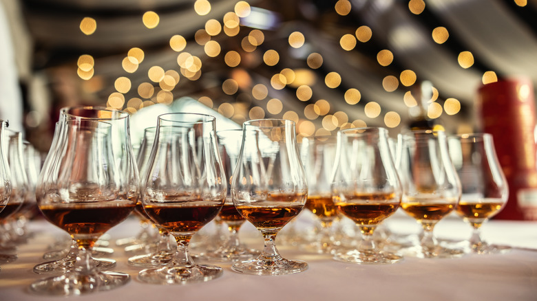 Rows of tasting glasses of bourbon