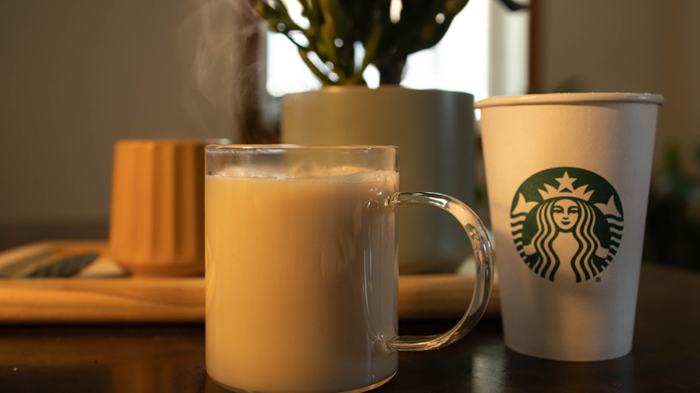 A hot chai latte in a glass mug