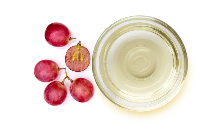 White wine vinegar glass bowl red grapes white