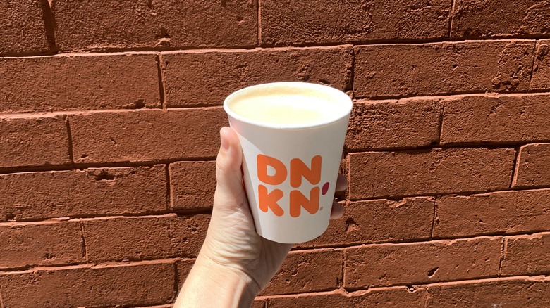 hot Dunkin cappuccino red brick wall