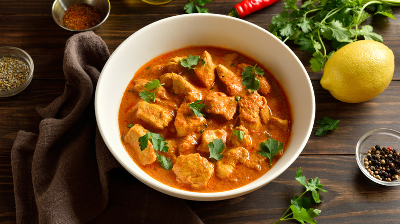 Chicken tikka masala in a white bowl.