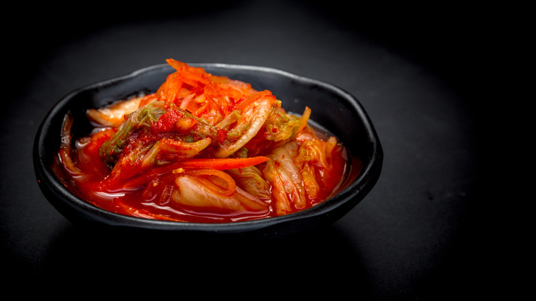 Kimchi in black bowl