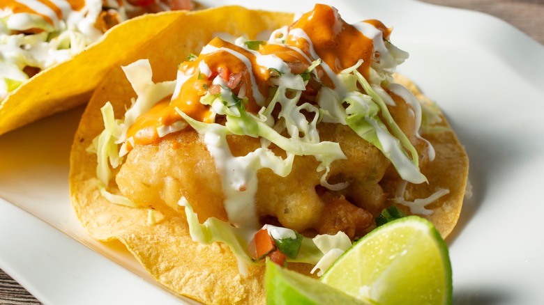 fried seafood taco with lime