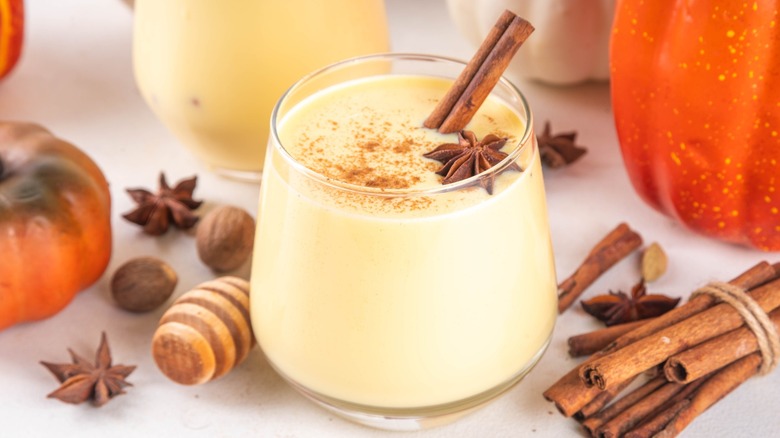 Glass of eggnog with grated nutmeg garnish