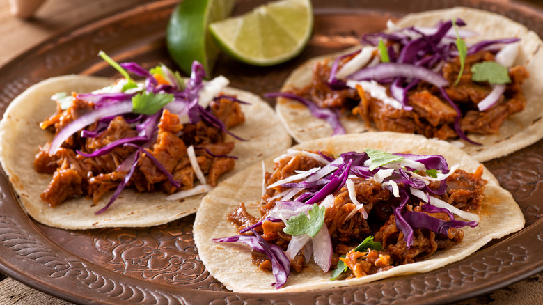 three carnitas tacos