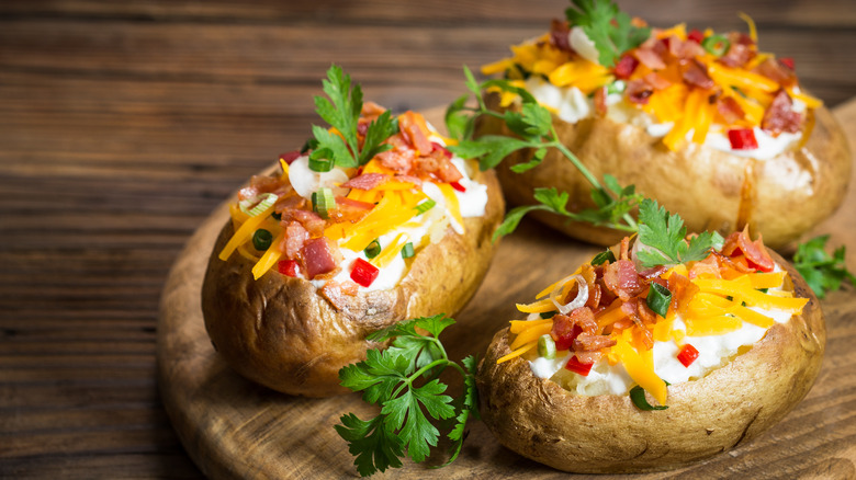 three loaded baked potatoes