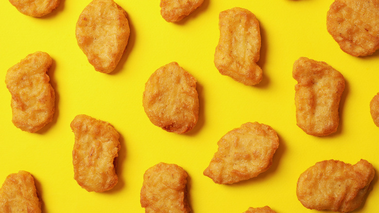 chicken nuggets on yellow background