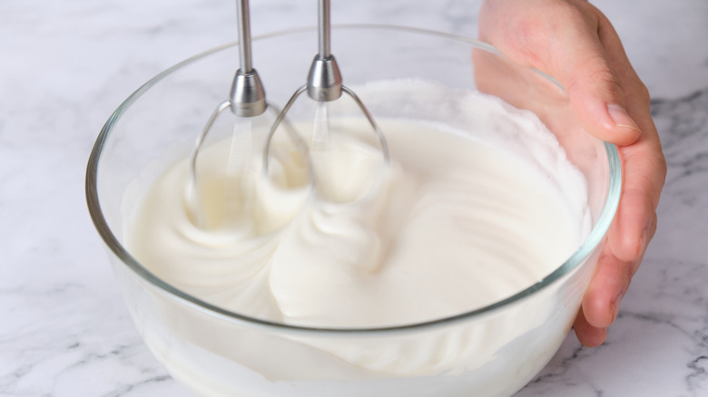 beater attachments whisking meringue in bowl