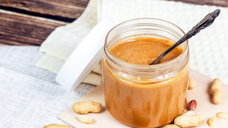 homemade peanut butter in a jar with spoon