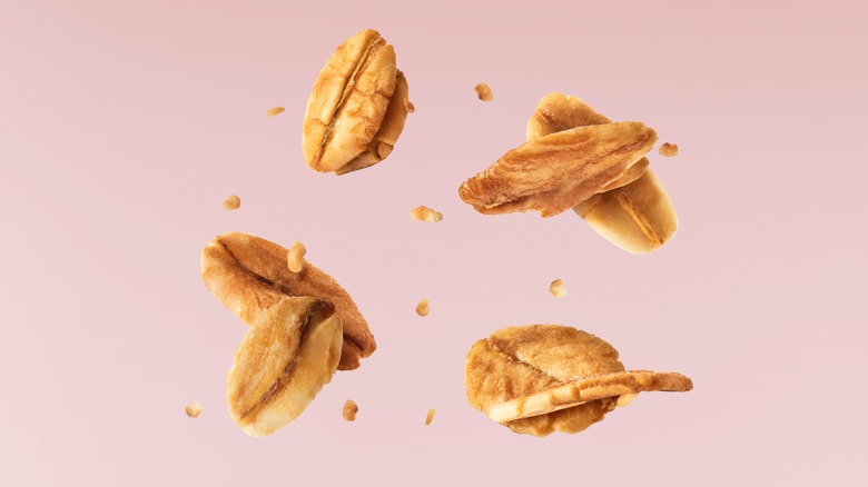 Granola Falling on Pink Background