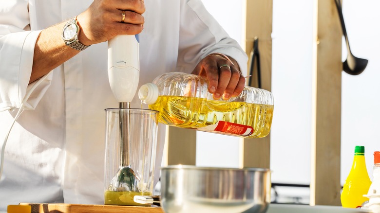 chef making salad dressing