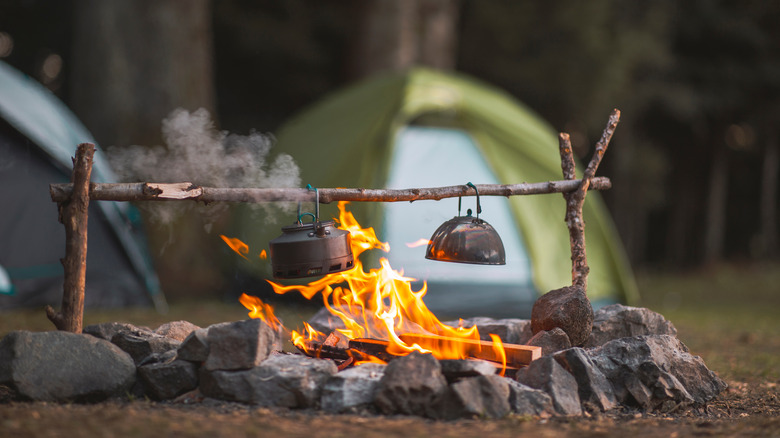 Tea kettles over blazing fire