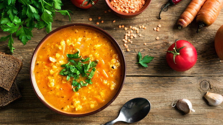 Red vegetable soup on wood table