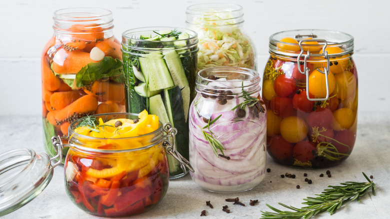 Glass jars of pickled vegetables