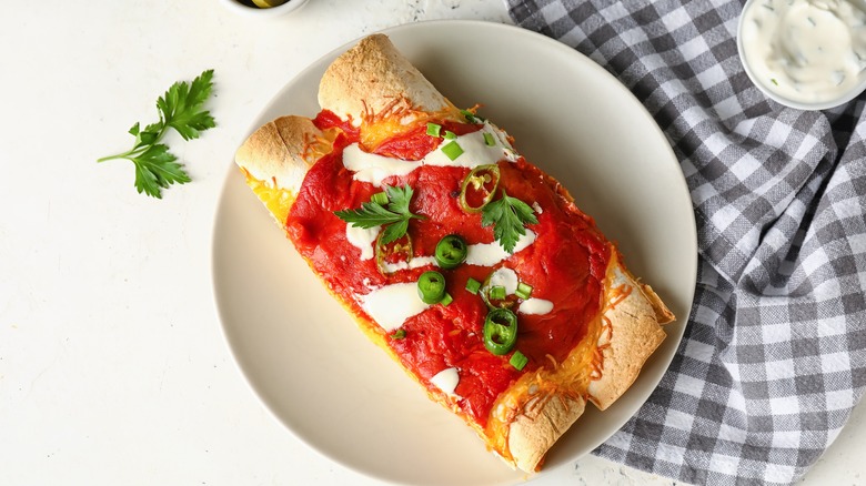 Cooked enchiladas on plate