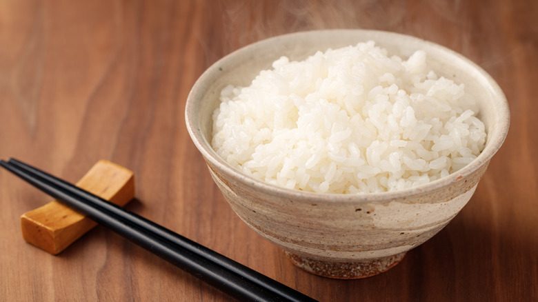 bowl of rice with chopsticks