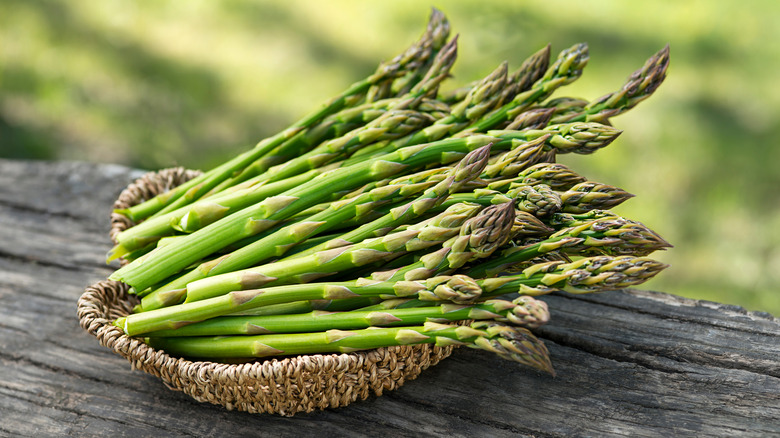 bunch of asparagus in basket