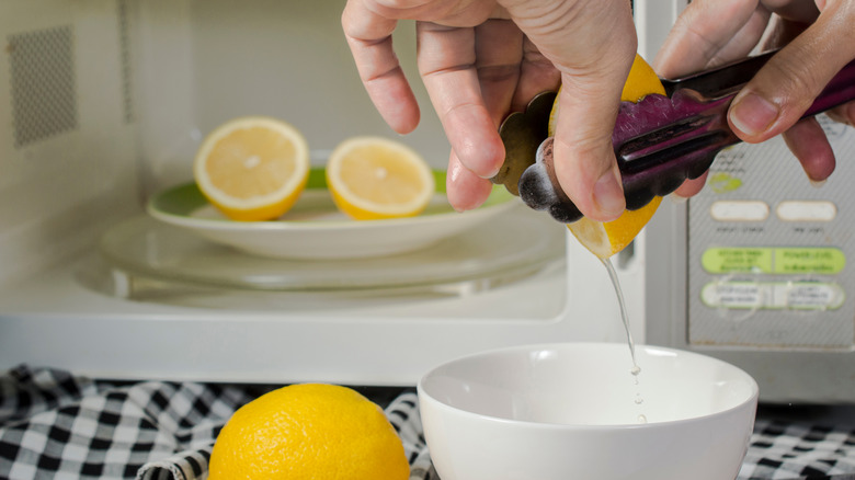 Juicing lemons with tongs