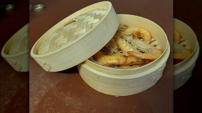 Bamboo steamer basket with shrimp