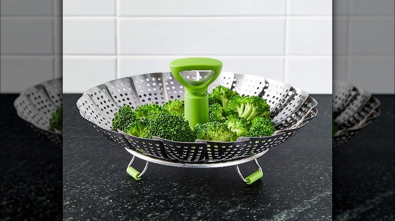 Crate & Barrel stainless steel steamer basket with broccoli 