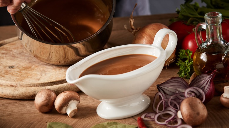 Whisking gravy in bowl gravy boat