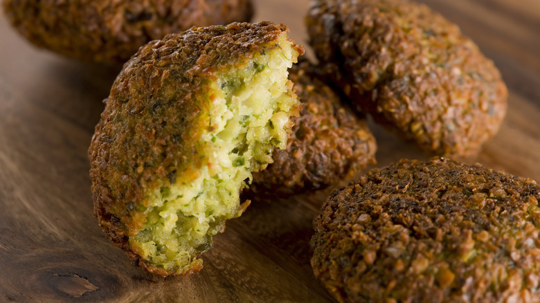 falafel balls on wood surface